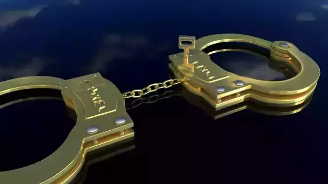 handcuffs golden on sky