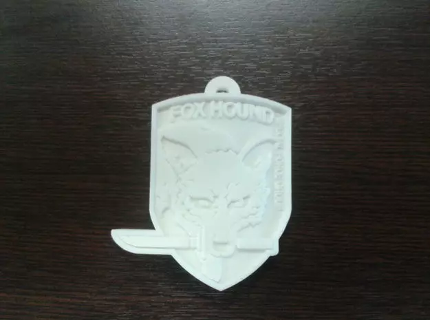 Foxhound logo on piece of plastic Free 3D print model
