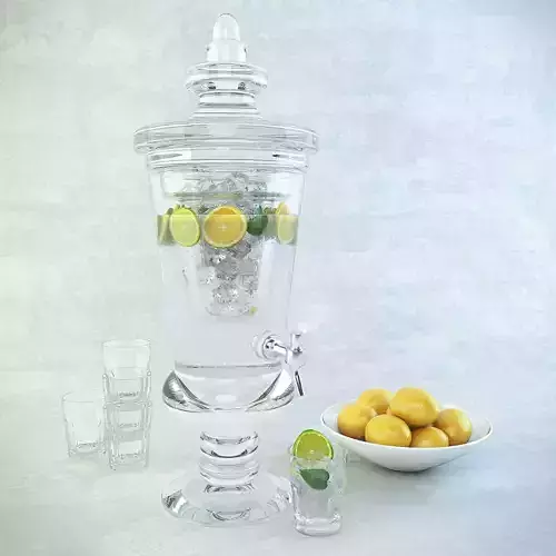 Carafe of lemonade glasses and a plate with lemon
