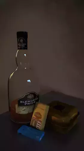 ashtray whisky bottle cigarette packet gaslighter