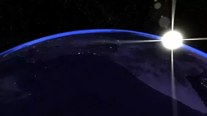 Earth from space with sun shining