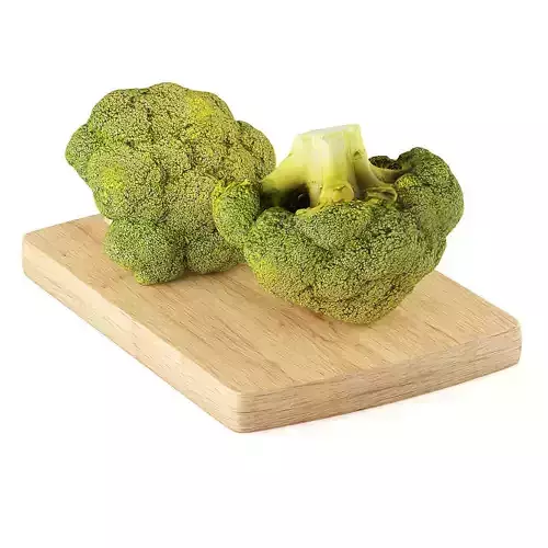 Broccoli two pieces of on cutting board