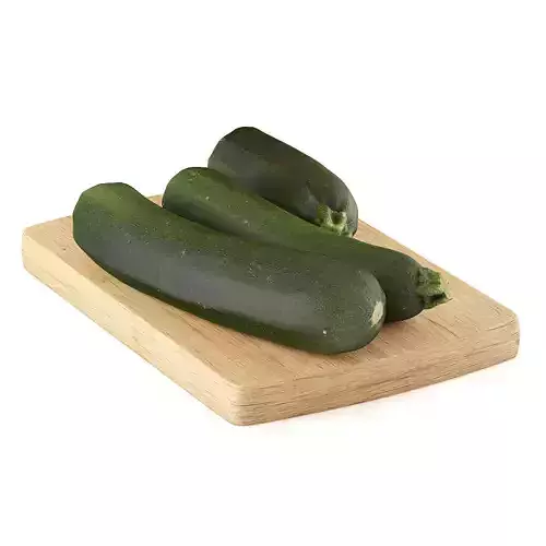 Zucchini three on wooden cutting board
