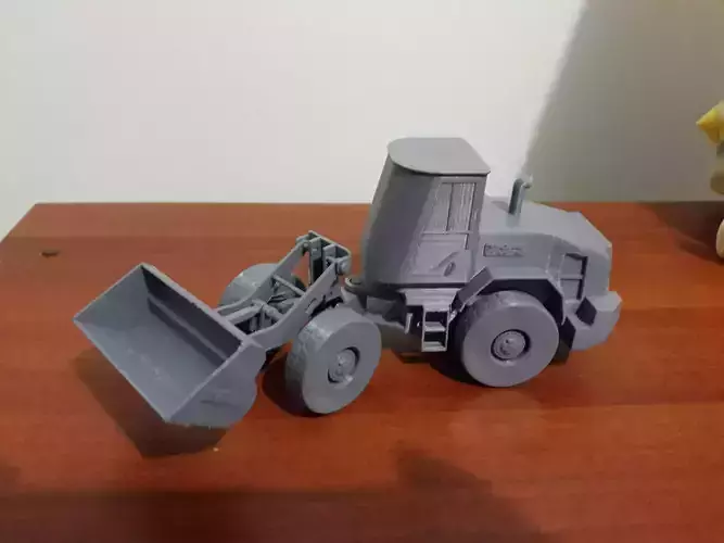 Loader toy bulldozer on table 3D print model