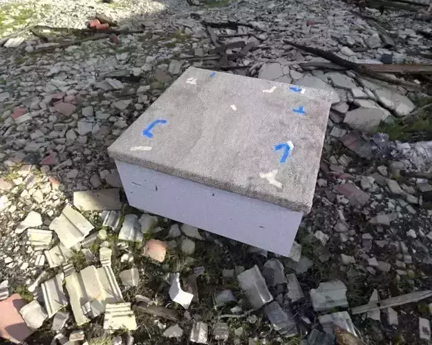 Box with dirty taped up carpet top