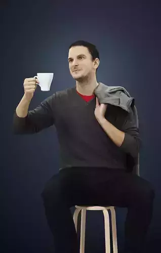 Jest A Casual Sitting Man Holding A Cup Of Tea 3D model