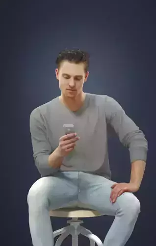 Virtue A Young Sitting Man Casually Texting On His Cell Phone Low-poly 3D model