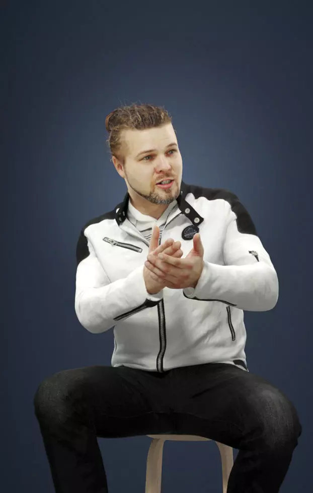 Keen Casual Sitting Man In Jacket And Jeans Explaining Low-poly 3D model
