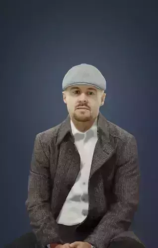 Master A Sitting Man In A Winter Coat And A Newsboy Tweed Cap Low-poly 3D model