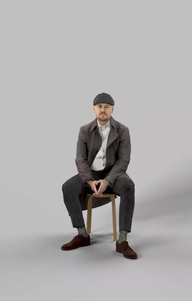 Master A Sitting Man In A Winter Coat And A Newsboy Tweed Cap Low-poly 3D model_0