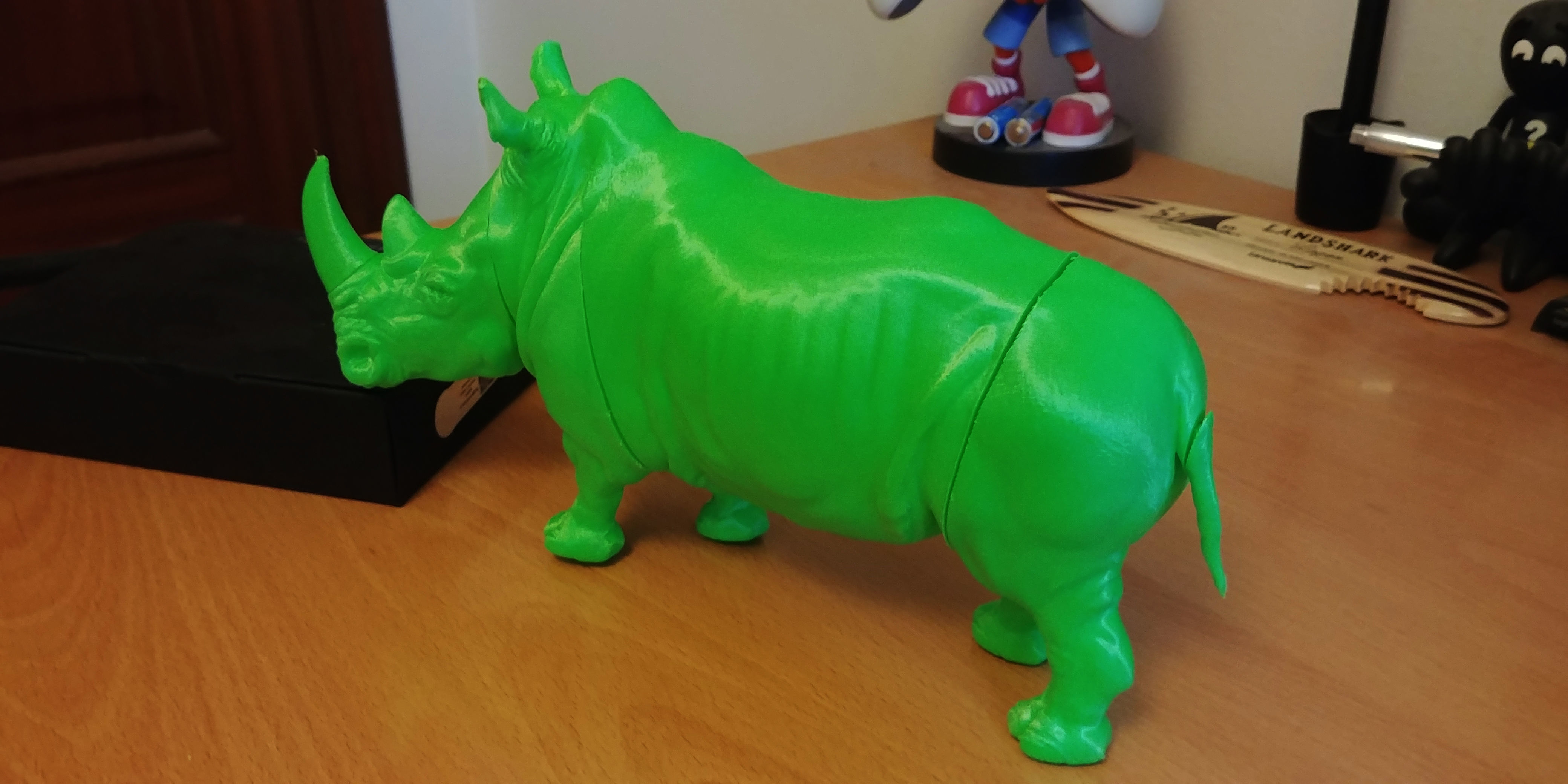 Rhinoceros plastic toy on wooden table 3D print model_12