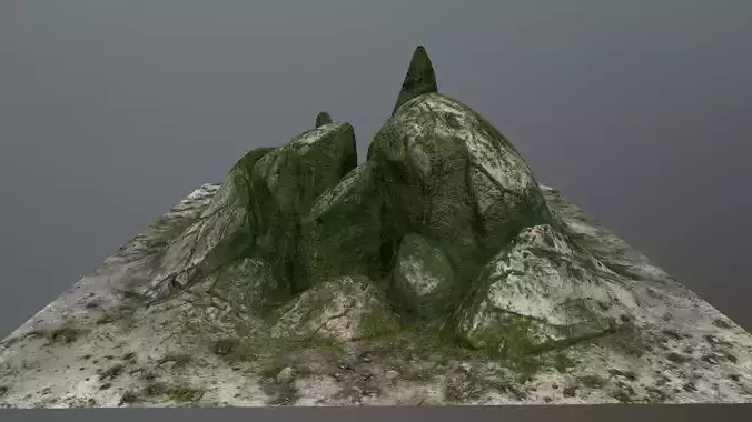 rocks mountain with grass on top