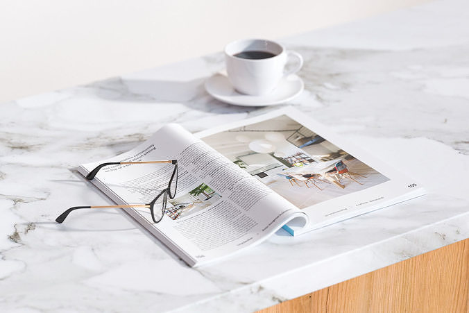 A magazine next to cup of coffee 3D model