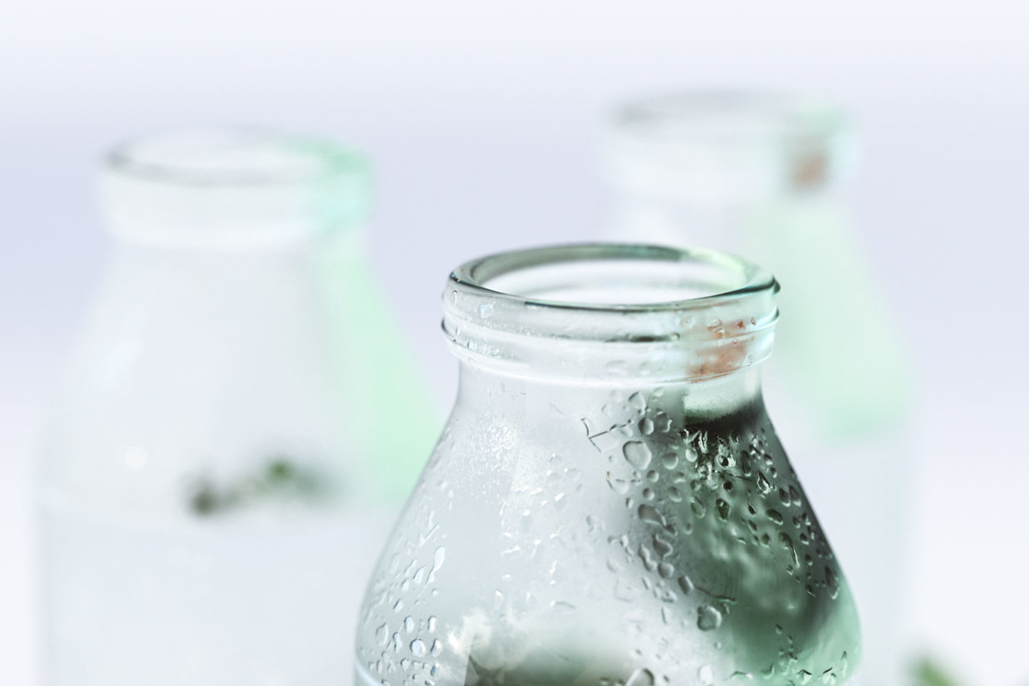 Glass bottles with water standing on a pad 3D model_3