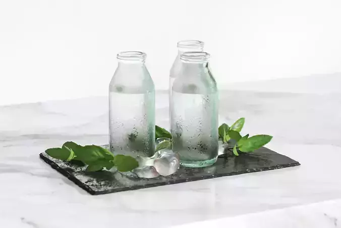 Glass bottles with water standing on a pad