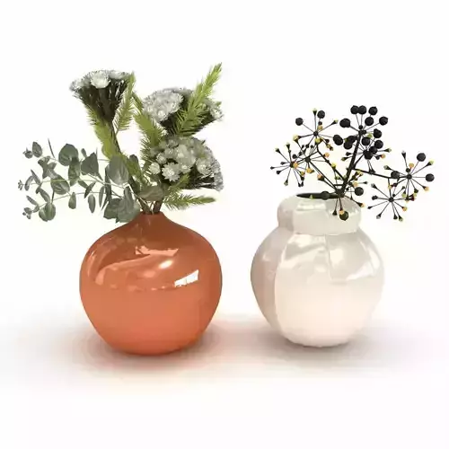 Two flower arrangements in white and orange ceramic vases 