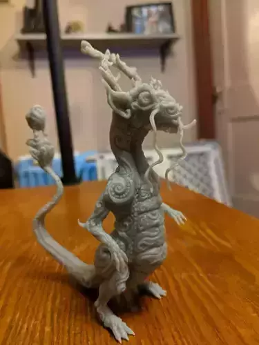 Lizard dragon figurine on table