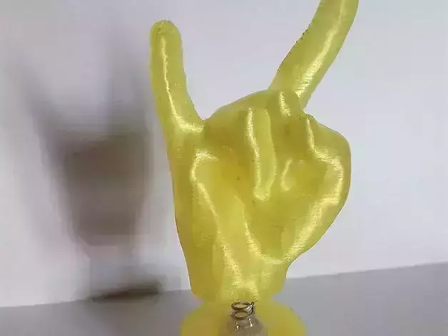 Metal hand making peace sign