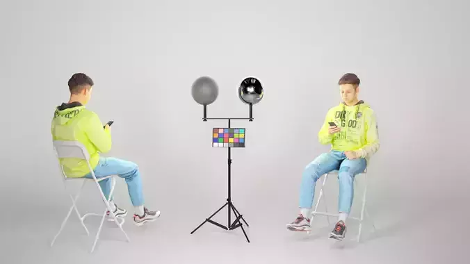 Young man sitting on a chair and typing a message 55
