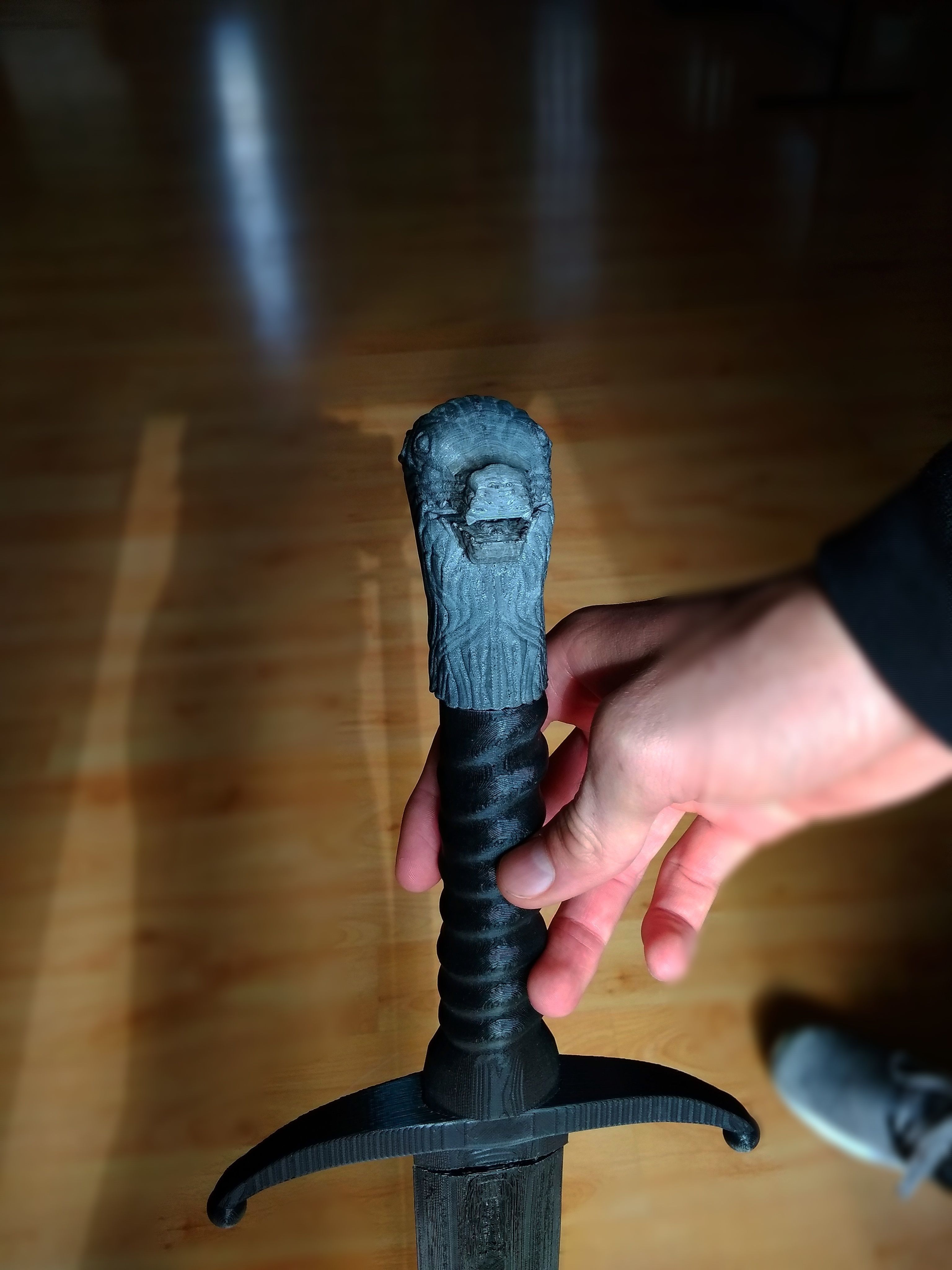 Longclaw sword in hands of person 3D print model_1