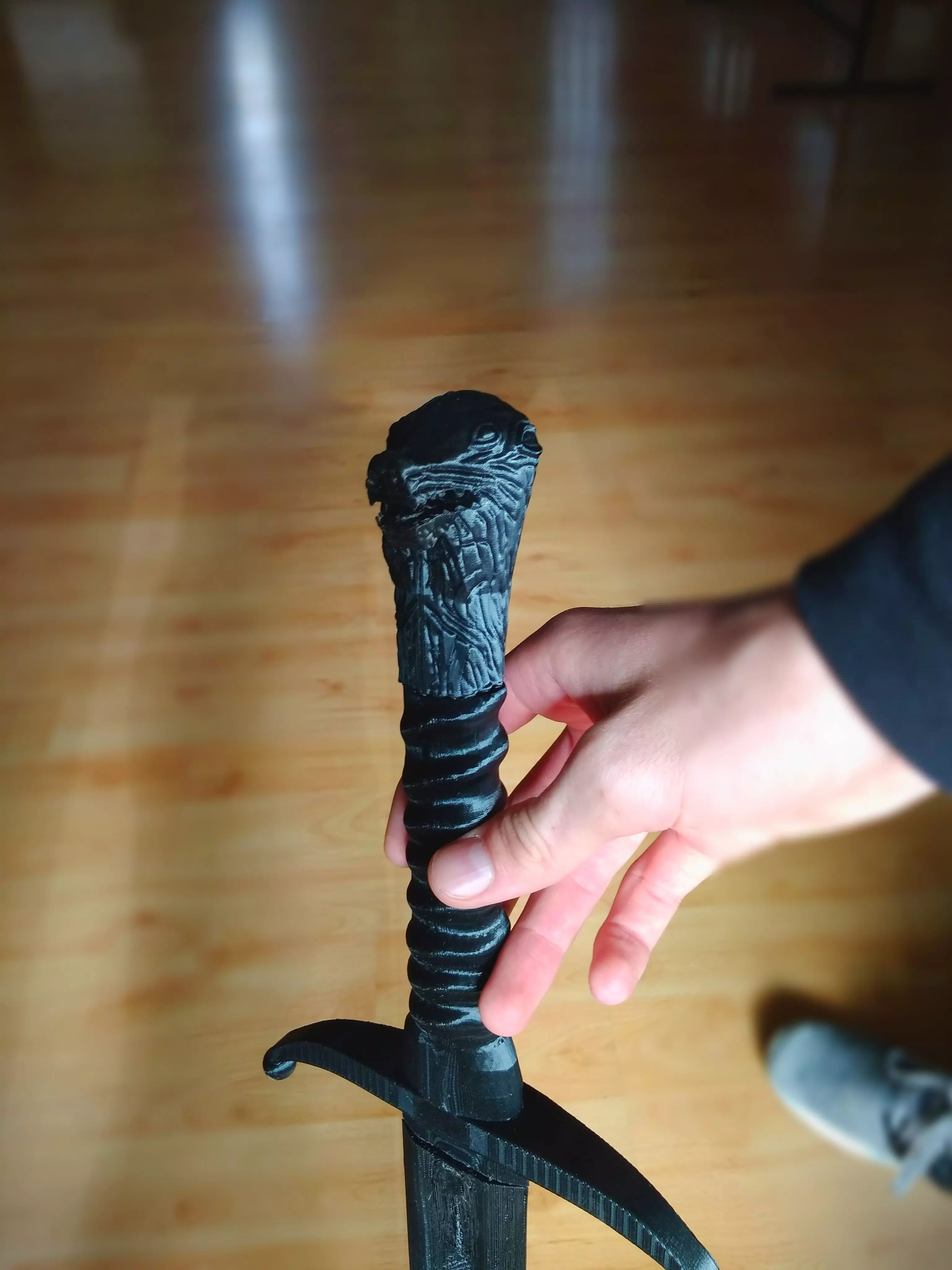Longclaw sword in hands of person 3D print model_0