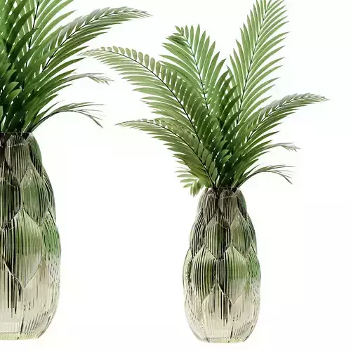 Exotic green glass vase with Howea plants