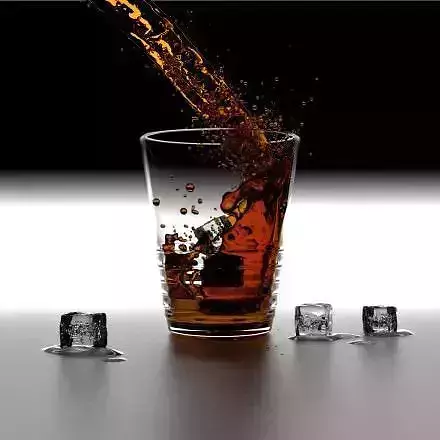 Realistic Fluid ice cubes pouring into glass of whiskey Free 3D model