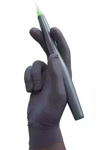 Hand holding tattoo machine