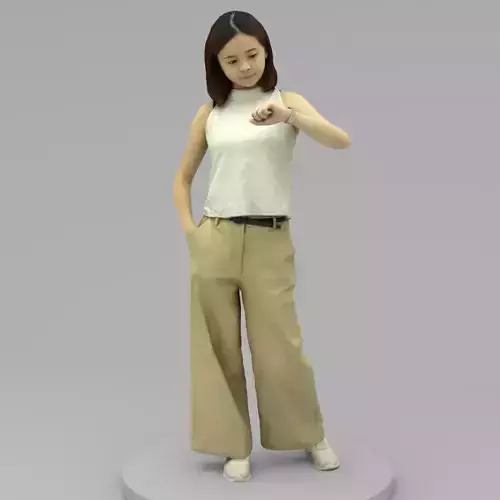 A Young Woman Looking At Her Watch