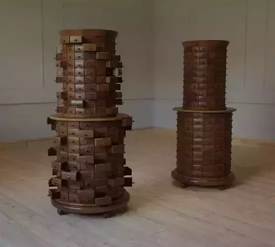 WARENKASTEN two wooden cylinders