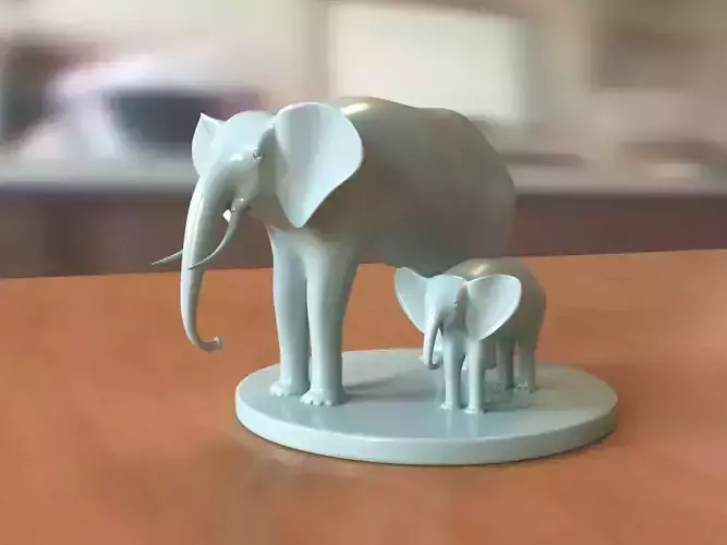 Elephant two figurines on table