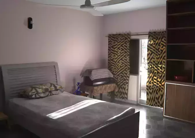 Bedroom with bed and fan