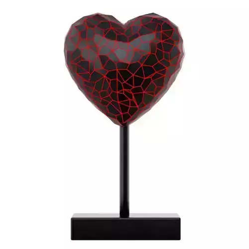 Cracked figurine of a black heart with red veins