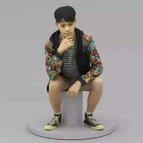 A Tall Young Man Pose Sitting Down