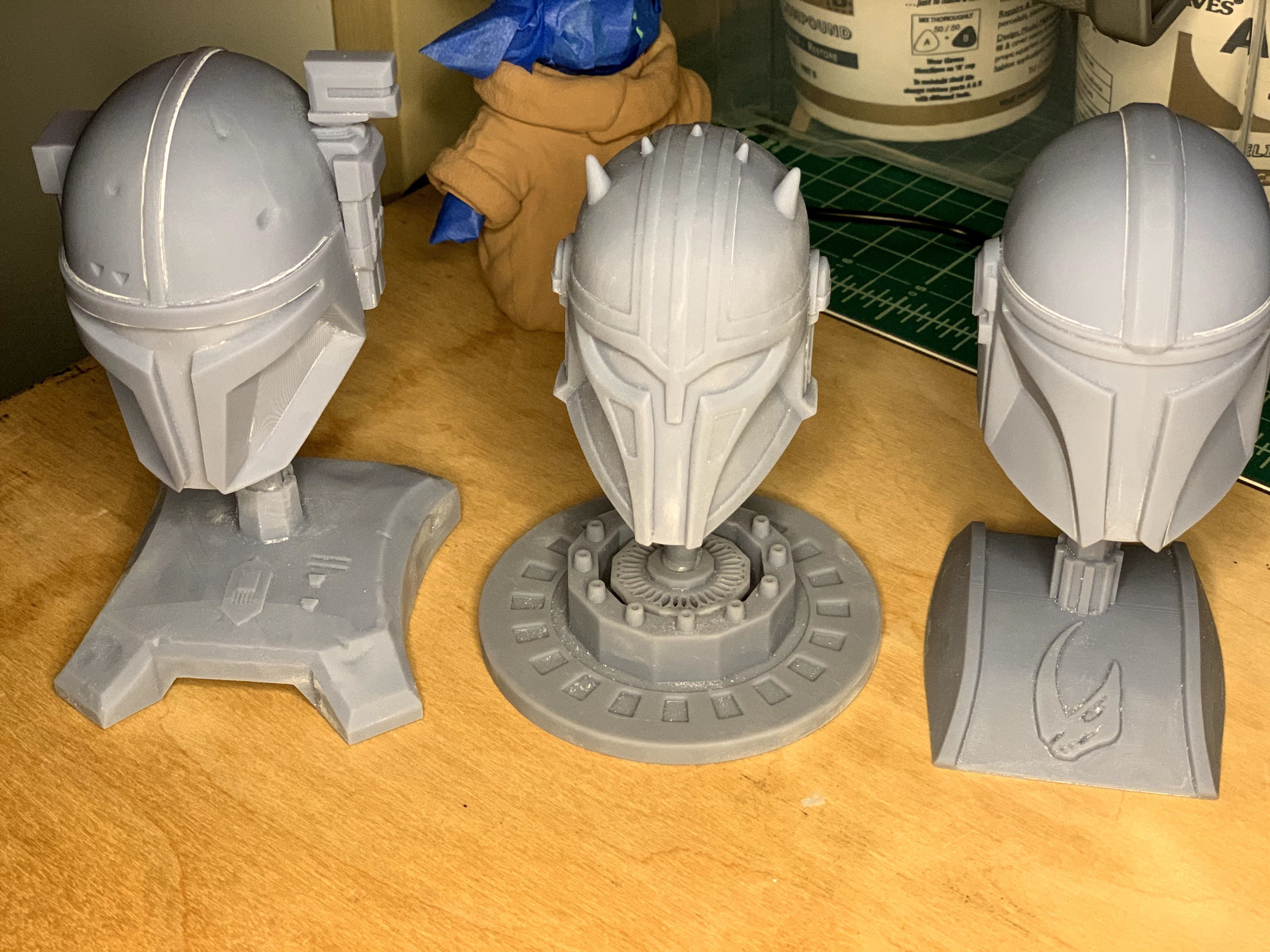 The 3 Mandalorians three star wars helmets on table 3D print model_21