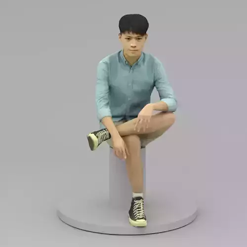 A Tall Young Man Poses Sitting Down II
