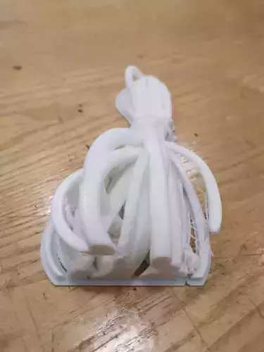 Model piece of plastic on wooden table