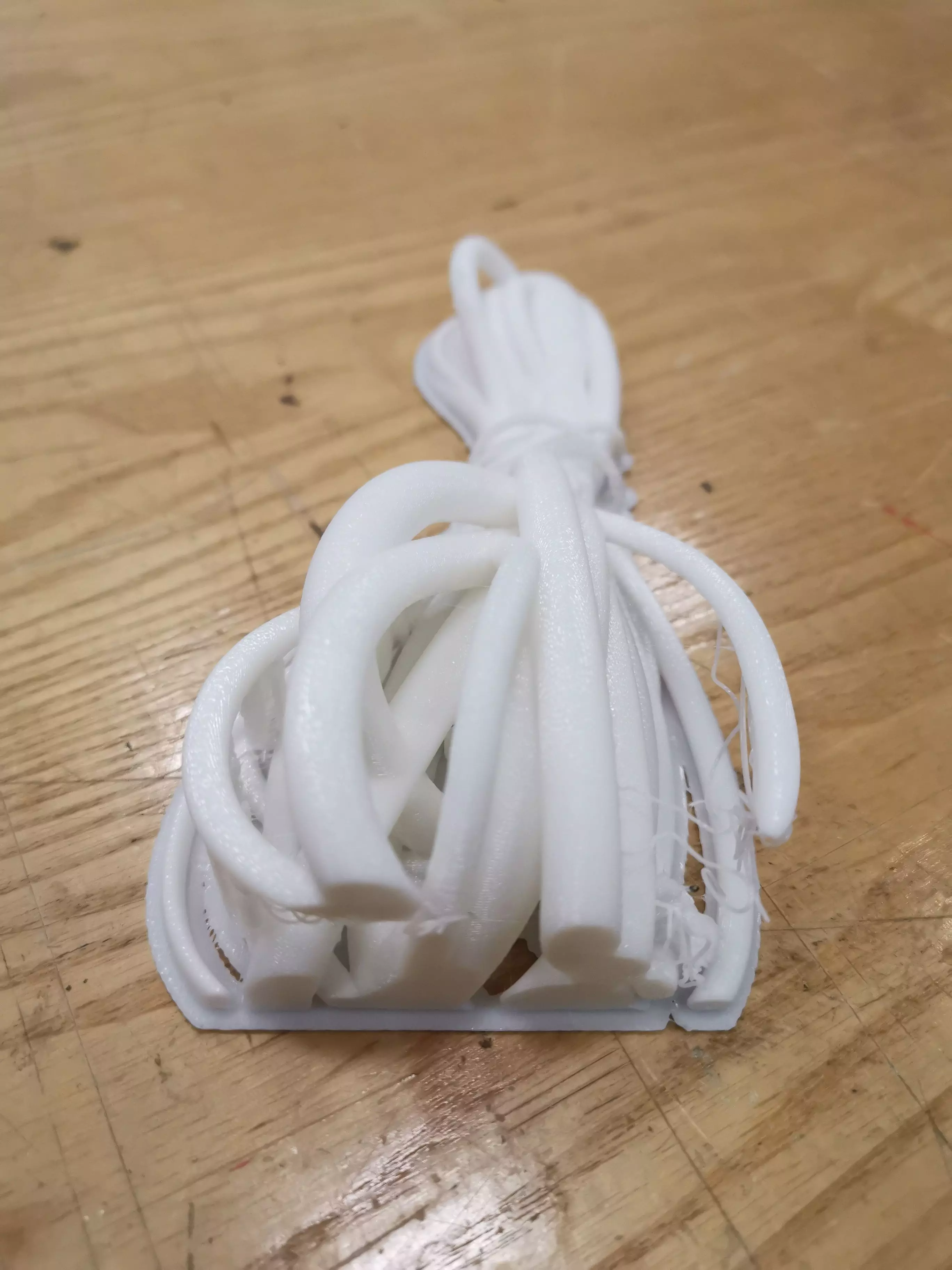 Model piece of plastic on wooden table 3D model_0