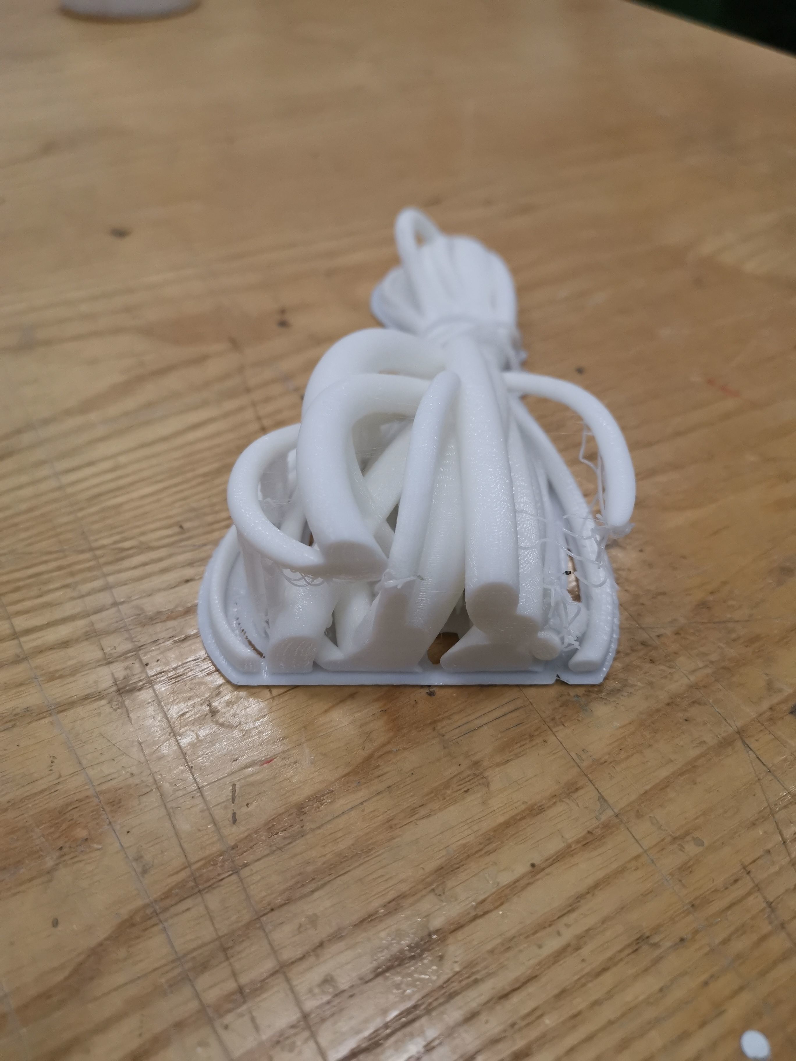 Model piece of plastic on wooden table 3D model_1