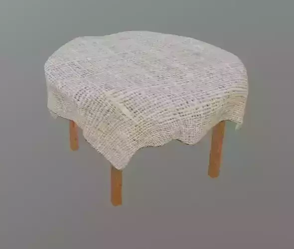 TableWithCloth burlap covered table with wooden legs