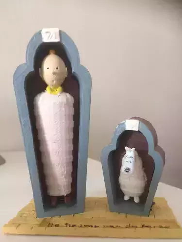 Tintin and Snowy in the sarcophagus