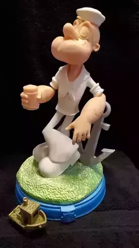 Popeye figurine of sailor holding cup