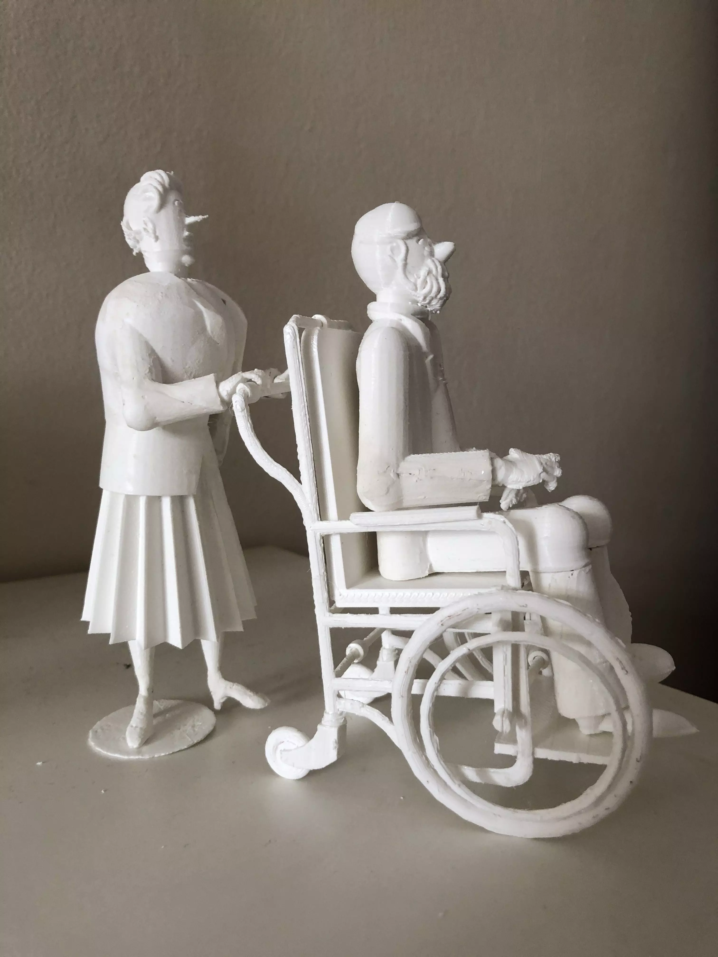 Captain Haddock in wheelchair pushed by Bianca 3D print model_0