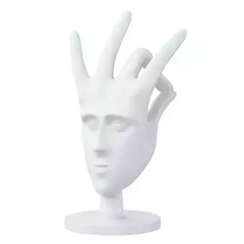 Decorative figurine face from hand