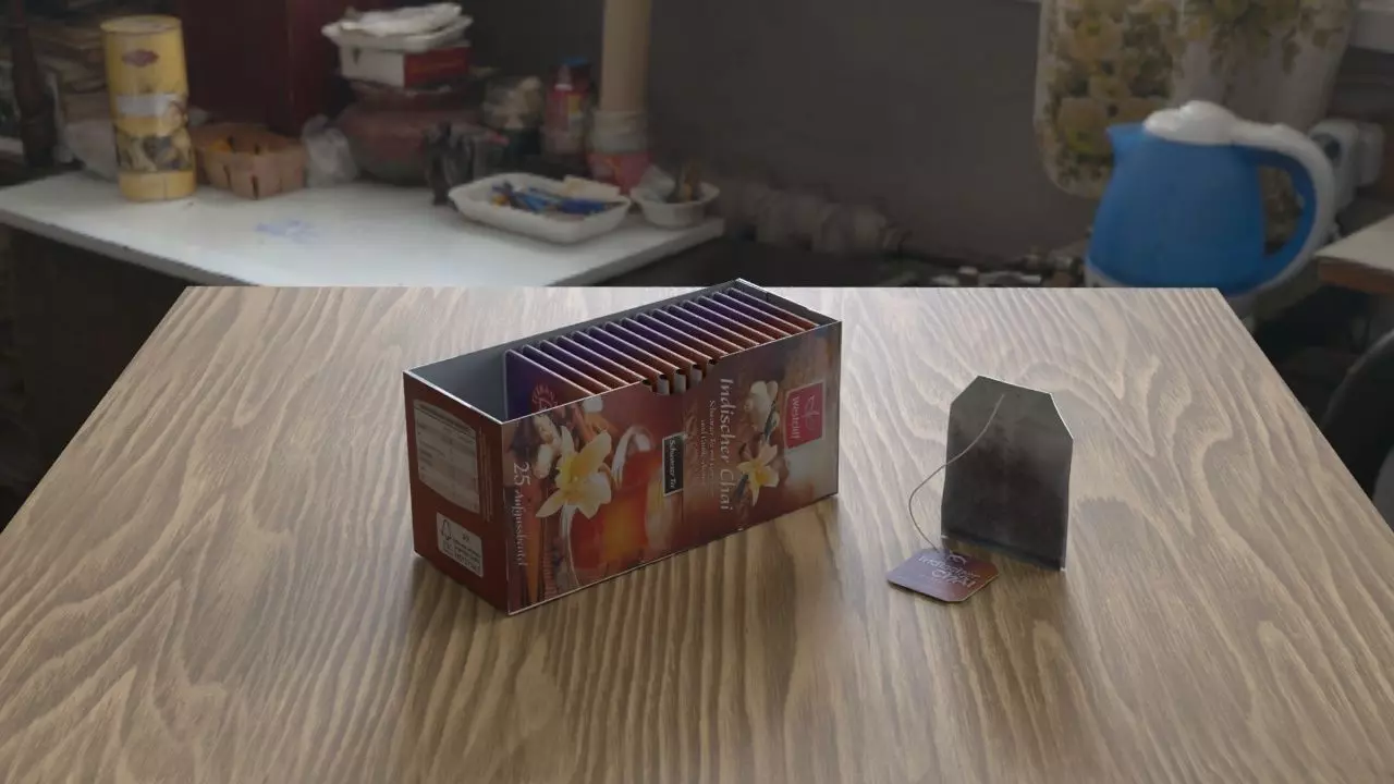 Teabox with teabags one of them unpacked Free low-poly 3D model