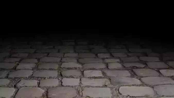 Cobble cobblestone street at night