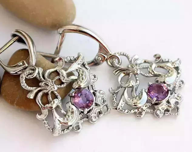 Dangle earrings with openwork pattern in fantasy style