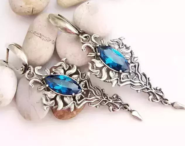 Long evening earrings with marquise cut stones