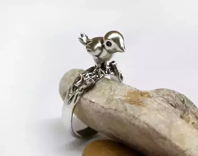 A cute sculpted ring with a little bird