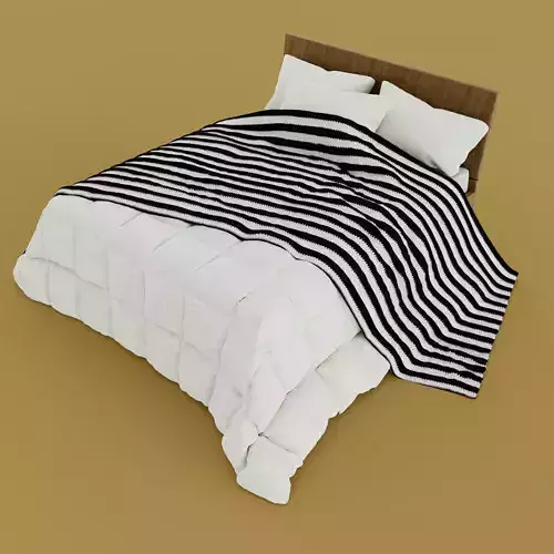 Bed with duvet and pillows